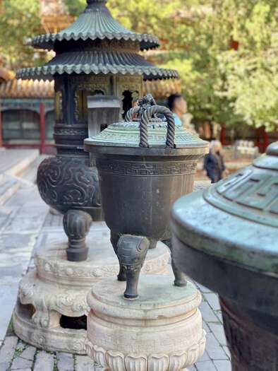 Bronze urns in an outdoor courtyard