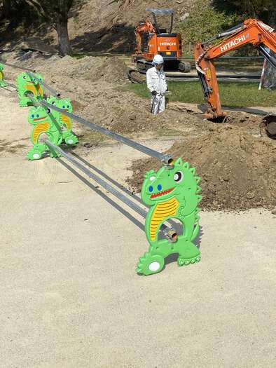Crocodile barrier around road works at the park