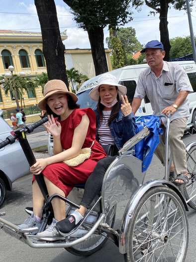 Our tour guides on a Cyclo, holding Dad’s Unawheel