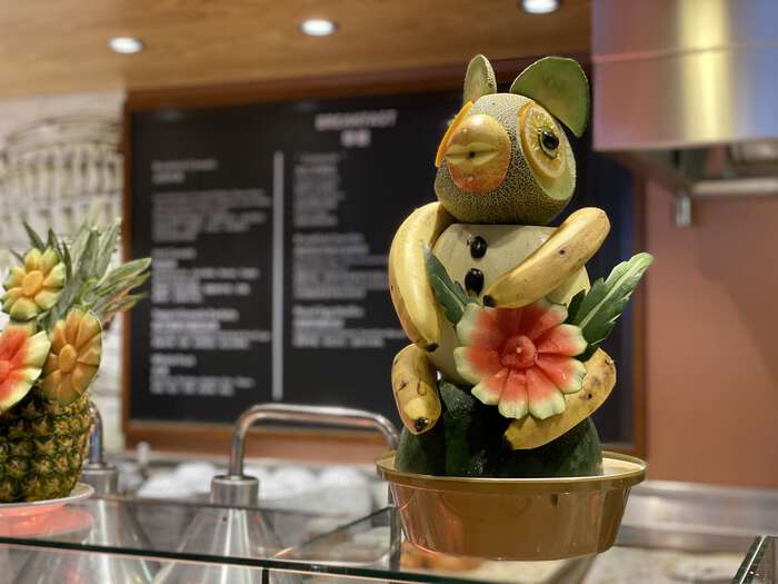 Animal sculpture made out of fruit, in one of the onboard cafes