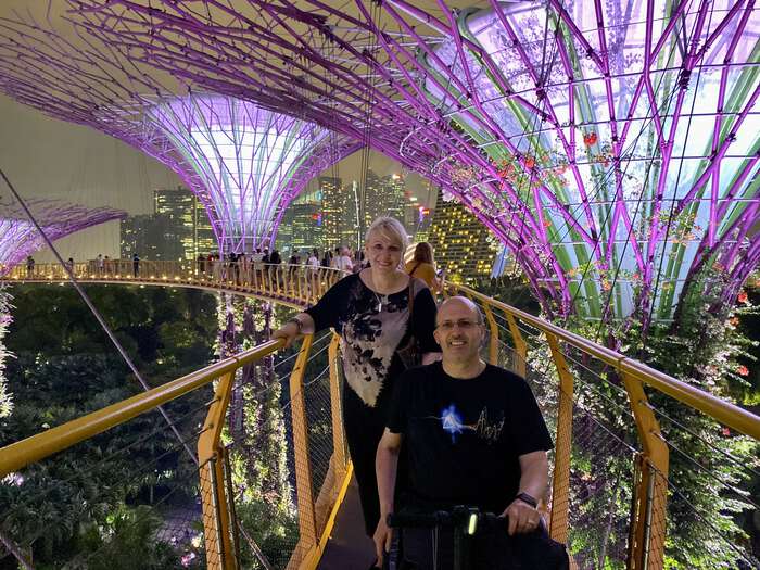 Nino and Julijana on the walkway high up in the Supertree canopy, at night