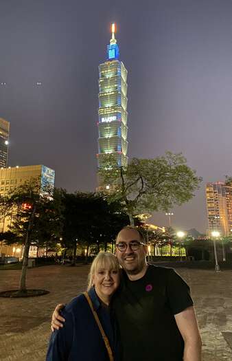 Julijana and Zarino in front of Taipei 101 at night