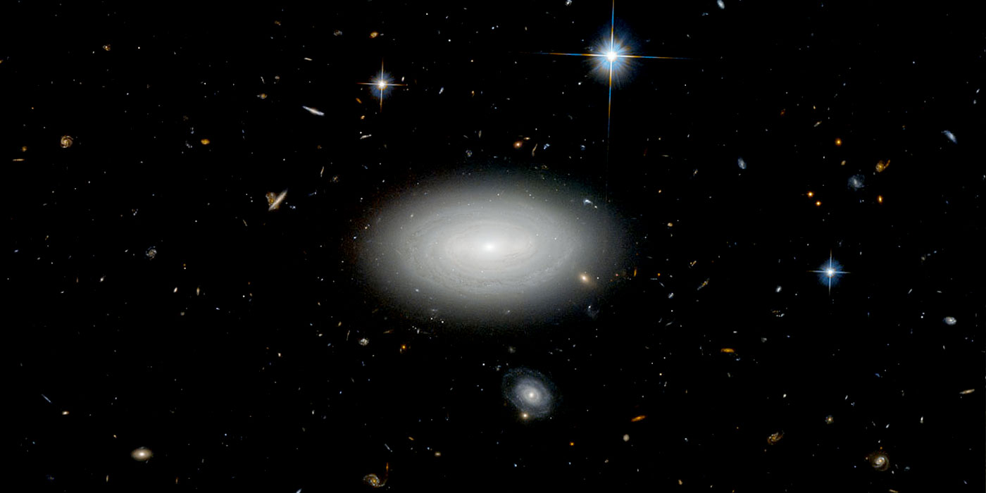 Galaxies, with the remote MCG+01-02-015 in the middle