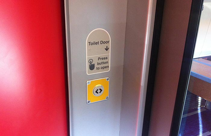 Button for opening the toilet door on a Virgin Pendolino train